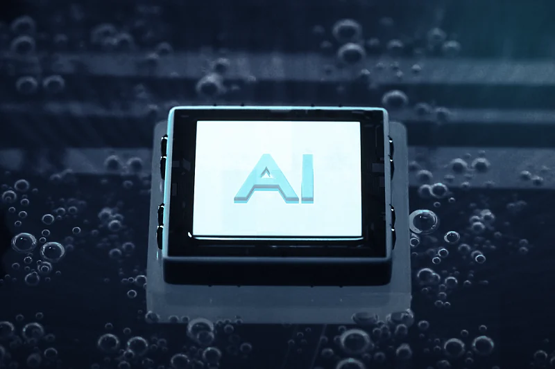 A glowing AI chip on a circuit board in cool cyan light